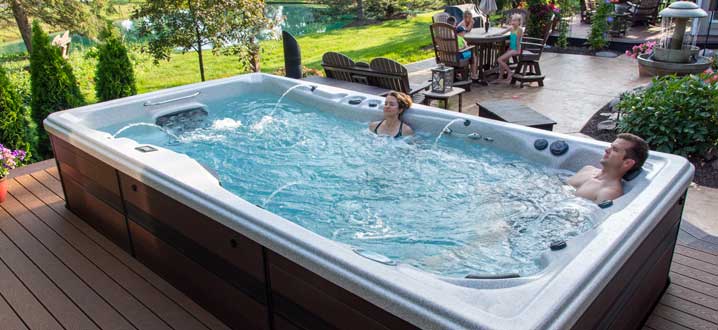 backyard install of a swim spa on a deck